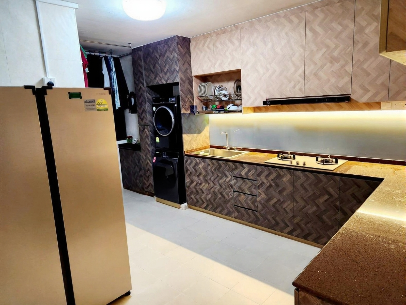 Modern kitchen with stainless steel appliances and patterned cabinets