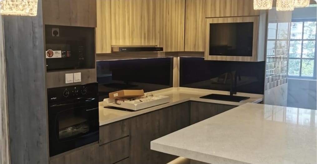 Modern kitchen with black appliances and white countertops