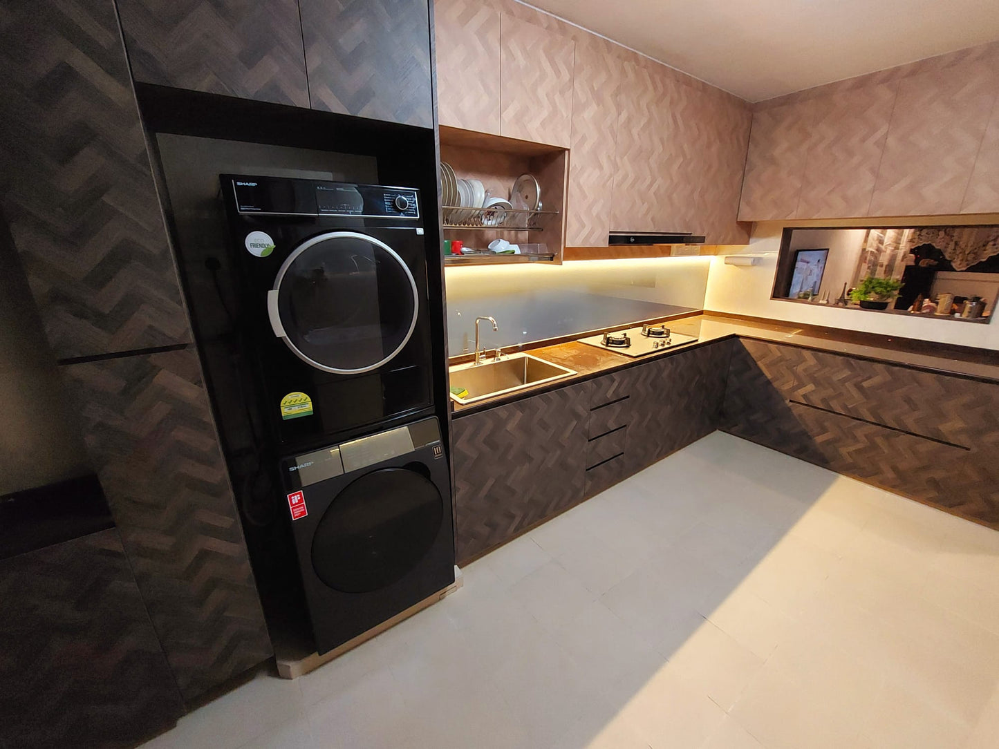 Modern kitchen with black appliances and textured walls