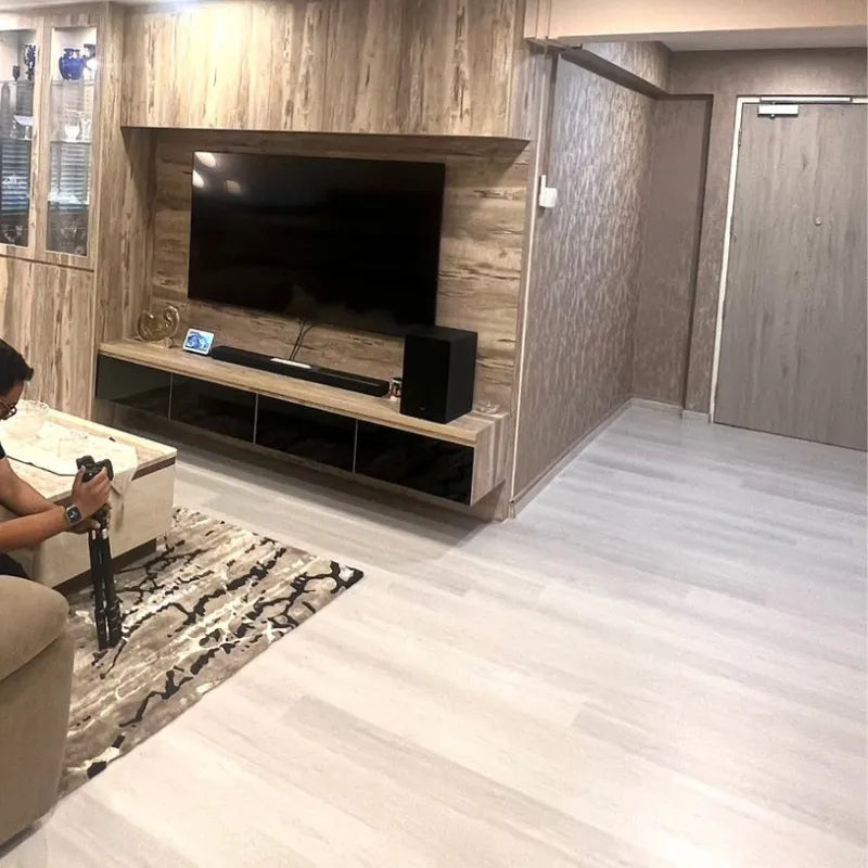 Living room with a television mounted on a wooden wall