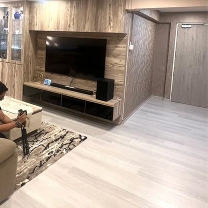 Living room with a television mounted on a wooden wall